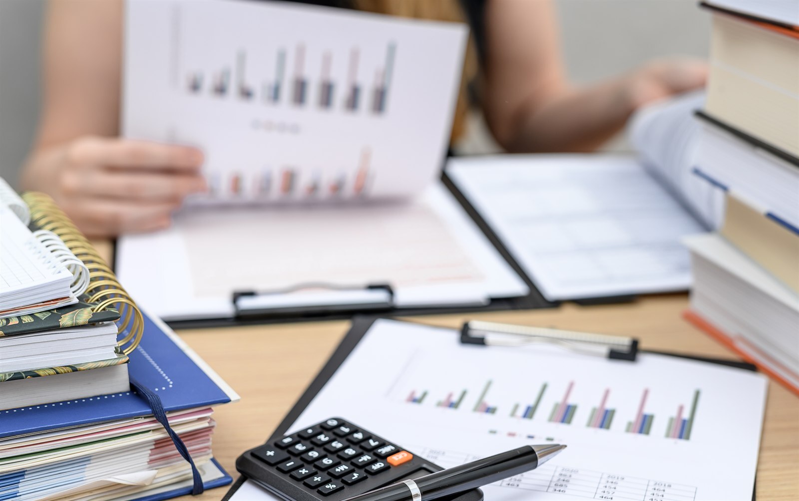 Accountant working through payroll figures at a desk